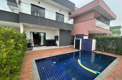 CAS261316 Sobrado no Condomínio Flora Rica Peruíbe com 4 suítes e piscina